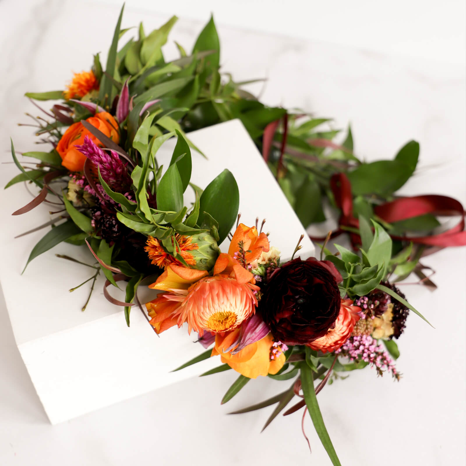 Pink, purple, orange and red flower crown with greenery